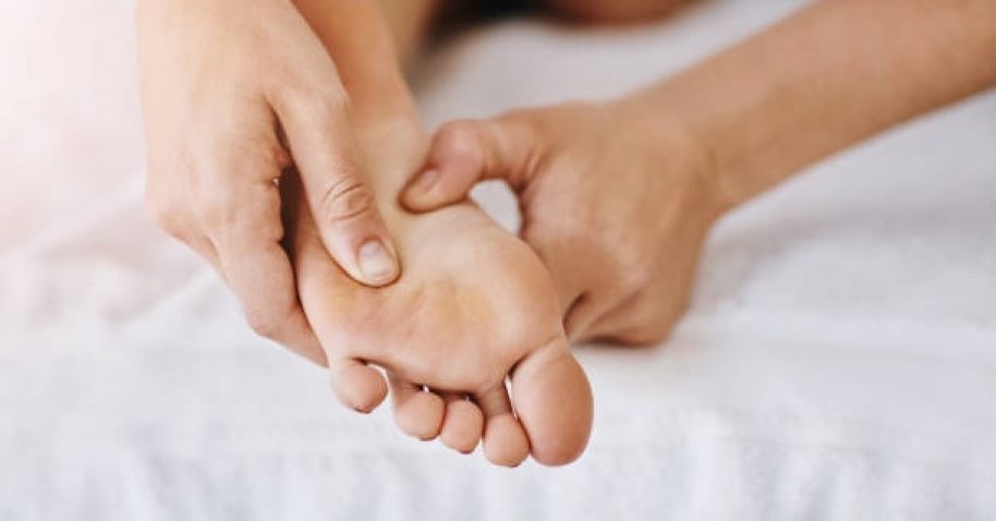 Cropped shot of a woman getting a foot massage at a beauty spa